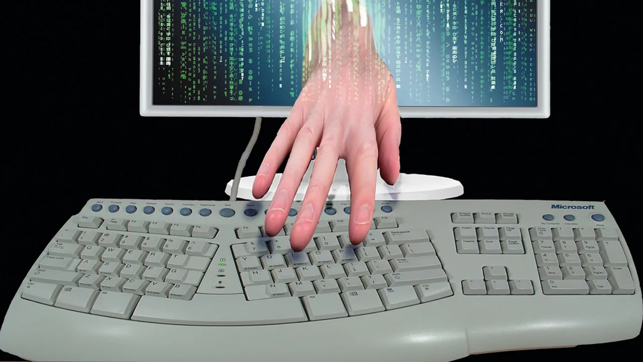 Credit card resting on a keyboard on a desk